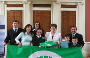 Representatives from Gaelscoil, Loch Buàreceiving the prestigious Green Flag Award
